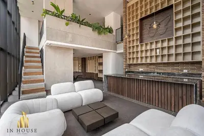 a living room with white furniture in a house at Morph 1501 - Vibrant apt in Poblado/AC/Jacuzzi/BBQ in El Poblado