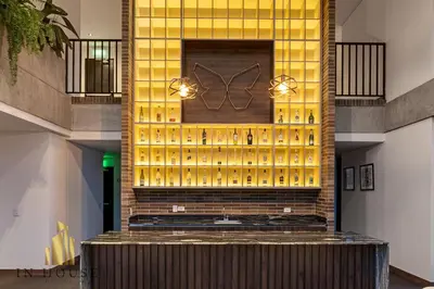 a tasting room with a wall of wine bottles at Morph 301 - Fresh Air Retreat in Poblado/AC in El Poblado