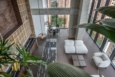 a living room with white furniture and large windows at Morph 301 - Fresh Air Retreat in Poblado/AC in El Poblado