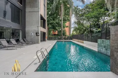 a swimming pool in the middle of a building at Morph 301 - Fresh Air Retreat in Poblado/AC in El Poblado