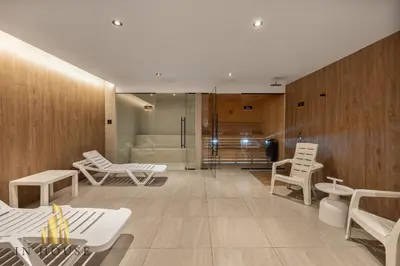 a room with white chairs and a bath tub at Morph 301 - Fresh Air Retreat in Poblado/AC in El Poblado