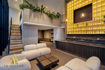 a lobby of a house with white chairs and a tv at Morph 601 - Elegance & tranquility with AC/BBQ in El Poblado