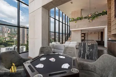 a room with a hot tub in a building with windows at Morph 601 - Elegance & tranquility with AC/BBQ in El Poblado