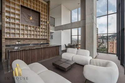 a living room with white furniture and a fireplace at Morph 701 - Spacious apt City View Haven in El Poblado