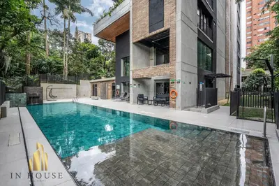 a swimming pool in front of a building at Morph 902 - Luxury Apt in Poblado with Balcony in El Poblado