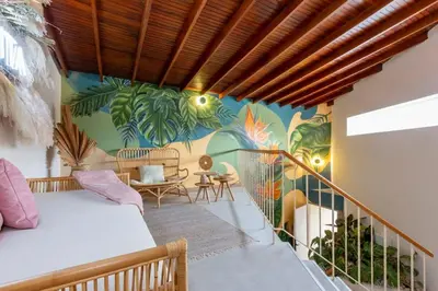 a room with a mural on the wall at Laureles Apt-Big Windows-Smart lock- AC in Medellín