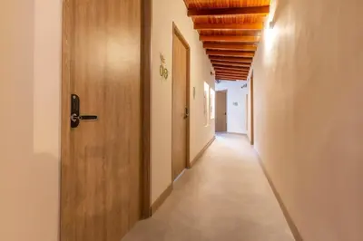 an empty corridor with a door and a corridorngthngthngthngthngthngthngth at Laureles Apt-Smart locks-Excellent Location-AC in Medellín