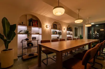 a dining room with a wooden table and chairs at 201 Stylish Retreat in Laureles Area Terrace AC in Medellín