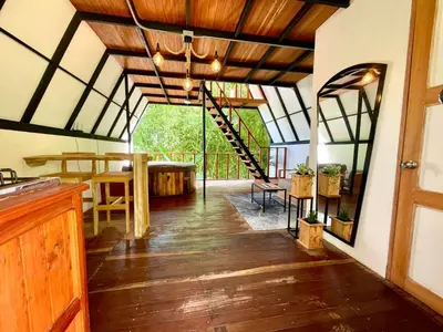 an open kitchen and dining room with a glass ceiling at Cabaña con jacuzzi en Venecia in Venecia