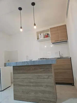 a kitchen with a counter top and a refrigerator at Vacacional amoblado Doradal 302 in Doradal