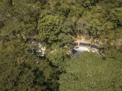 an overhead view of a house in the forest at Cabaña El Bosque - En medio del bosque - Jacuzzi Privado con Calefacción y Malla Catamarán - Cerca a Medellin in Sopetran