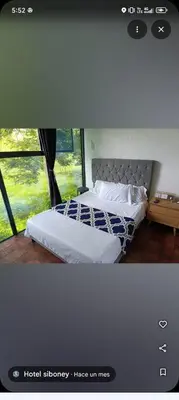 a bedroom with two beds and a window at Siboney family in Honda