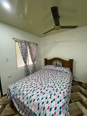 a bedroom with a bed and a ceiling fan at Apartamento Bustos 1 in Puerto Triunfo