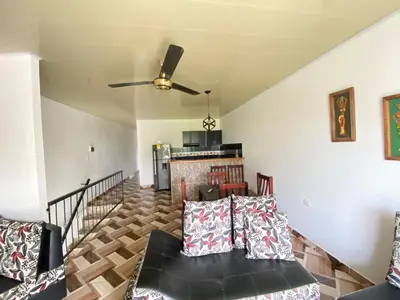 a living room with a couch and a fireplace at Apartamento Bustos 1 in Puerto Triunfo