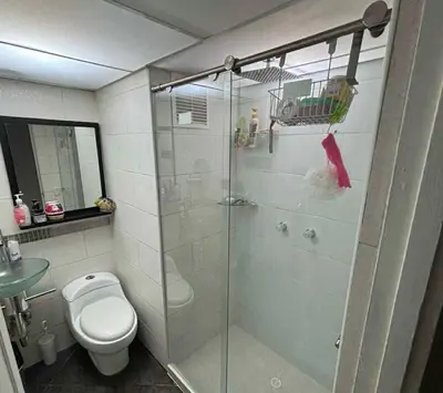 a bathroom with a shower and a toilet at Happy house in Medellín