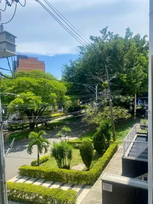 a view of a street with trees and bushes at Loft Laureles - Excellent location in Medellín