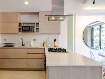 a kitchen with a white counter top and a sink at NOK Fantastic 3 BR w Balcony in Laureles Medellin in Medellín