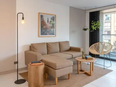 a living room with a couch and a table at NOK Fancy 3BR Balcony in Laureles Medellin in Medellín