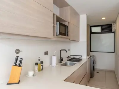 a kitchen with a sink and a counter top at NOK Lovely 3 BR with Balcony in Laureles Medellin in Medellín