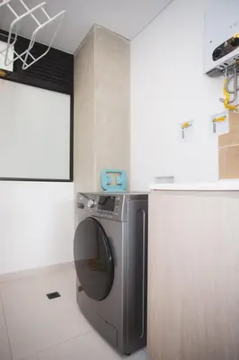 a kitchen with a washing machine in a room at NOK Perfect 3 BR in Laureles in Medellin in Medellín