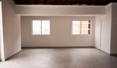 an empty room with two windows and a tile floor at 801-Acogedor Apto 2BR Parque Sabaneta in Sabaneta