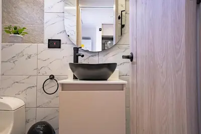 a bathroom with a sink and a mirror at Exclusivo Urban Loft en Laureles in Medellín