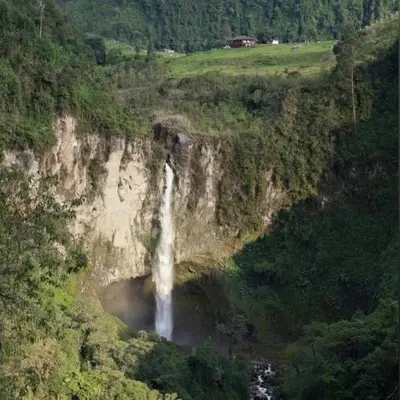 a waterfall on the side of a mountain at Hostal La Laguna in Villamaría