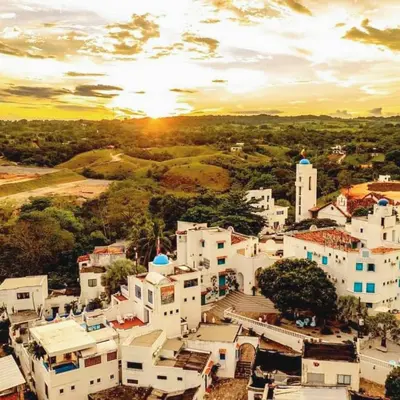 an aerial view of a town with white buildings at El santorini colombiano cabaña in Puerto Triunfo
