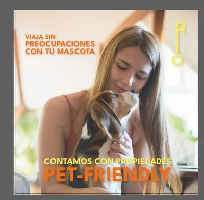 a woman holding a dog in her hands at Alojamiento en apartamento cerca a Provenza - M203 By Roots Rentals in Medellín