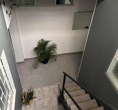 an overhead view of a staircase with a potted plant at Aparta estudio amoblado 3 Medellin, San joaquin in Medellín