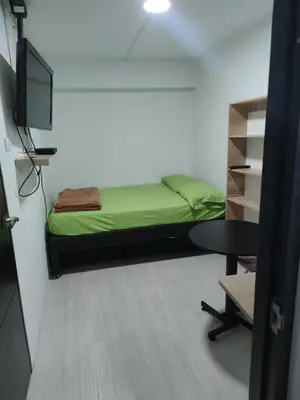a room with a bed and a table and a tv at HABITACION AMOBLADA SECTOR LAURELES-ESTADIO #1 Madrid in Medellín