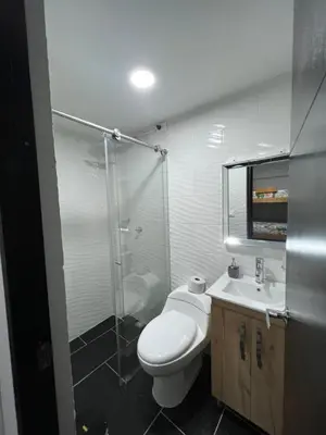 a bathroom with a toilet and a shower and a sink at HABITACION AMOBLADA SECTOR LAURELES-ESTADIO #1 Madrid in Medellín