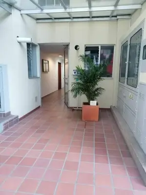 a hallway of a building with a potted plant at GIBRALTAR in Manizales