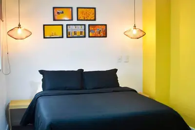a bedroom with a bed and three pictures on the wall at Apartamento de 3 habitaciones con jacuzzi deluxe! in Envigado