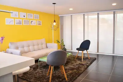 a living room with a couch and two chairs at Espectacular Apt de 3 habitaciones Deluxe! in Envigado