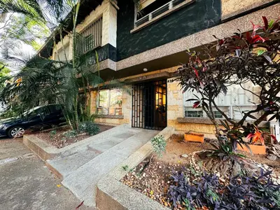 a building with a front door of a building at Alojamiento económico en Medellín - NID104 By Roots Rentals in Medellín