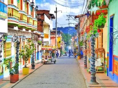 a painting of a city street with a trolley at Aparta Suite Torre De Prado 302 in Medellín