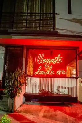 a neon sign in the window of a store at Apartamento en zona exclusiva de Bello, Cabañas in Bello
