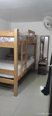 a room with two bunk beds and a mirror at 23 BELO APARTAMENTO CON BALCON EN LAURELES ESTADiO 2 HAB 2 BAÑOs in Medellín
