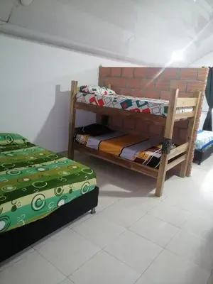 two bunk beds sitting in a room with at Casa lowcost relajación in La Dorada